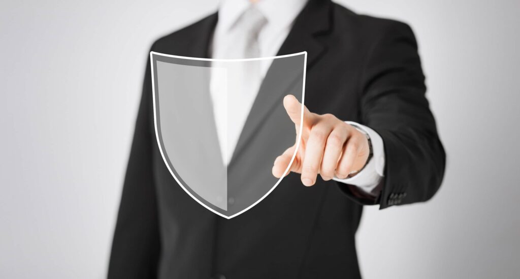Business man pointing towards security sign in the middle.